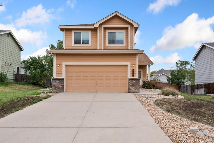 Front of the two-story home with a two-car garage
